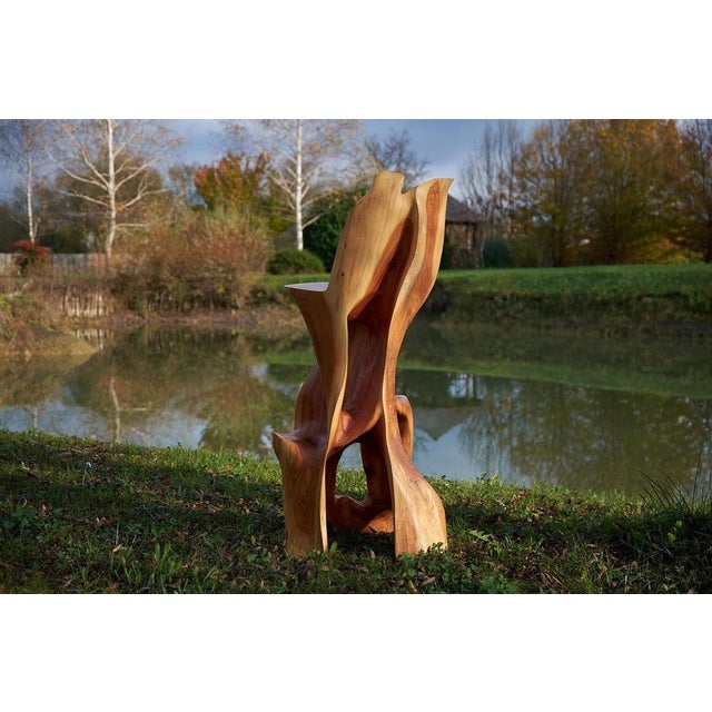 Unique chainsaw carved wooden functional sculpture usable as a bar chair. Carved from a single piece of wood and protected...