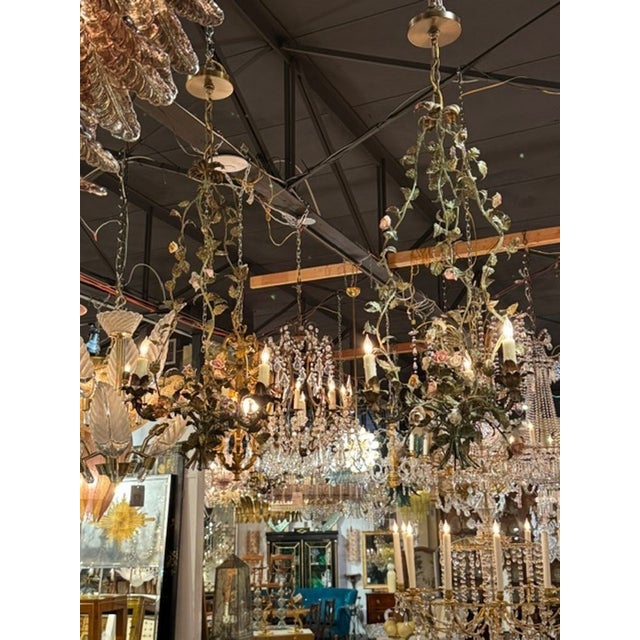 The French Antique Iron and Porcelain Flower Chandeliers are elegant and sophisticated lighting fixtures. Crafted with a...