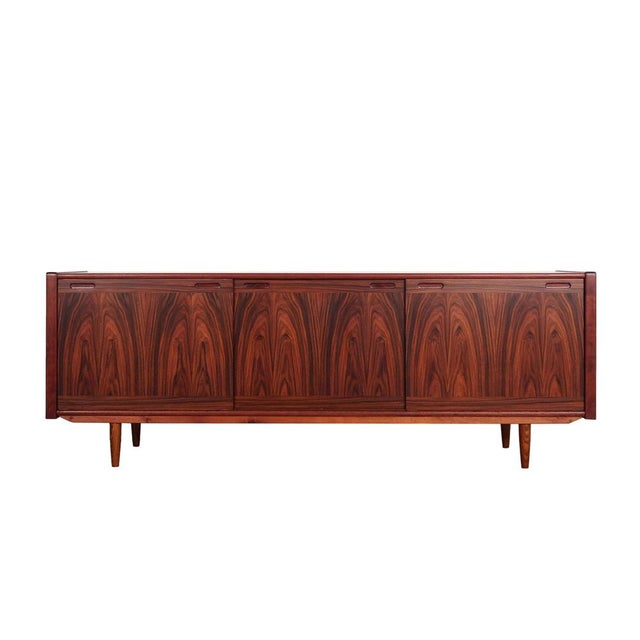 The sideboard was made in the 1970s by the renowned Danish manufacturer Skovby Møbelfabrik. The structure is covered with...