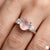 Professional Product Description: This elegant ring features a soft and romantic Rose Quartz gemstone at its center,...
