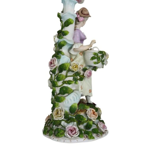 This exquisite pair of antique Meissen School candelabras, dating to approximately 1880, features intricate figural and...