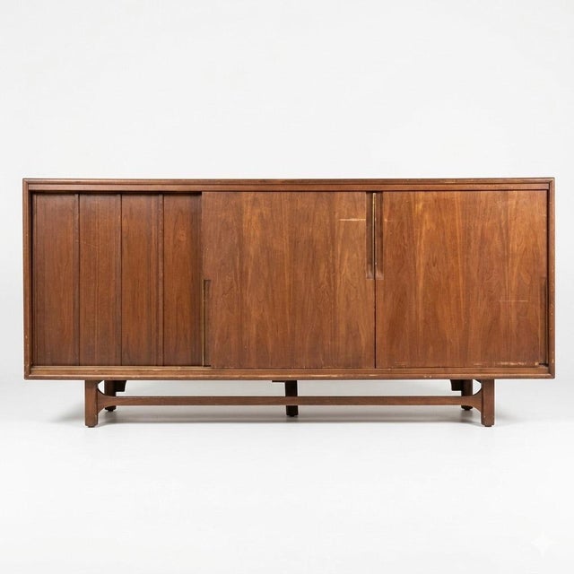 This 1960s vintage Mid Century Modern lowboy dresser by Cavalier Furniture showcases a clean, architectural profile with a...