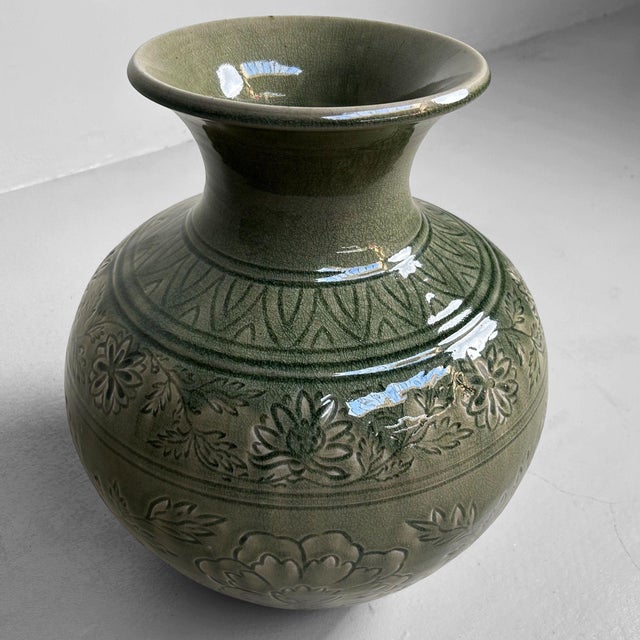 This exquisite Japanese celadon vase dates back to the 1960s and was crafted by the renowned ceramic master Noma Gazan....