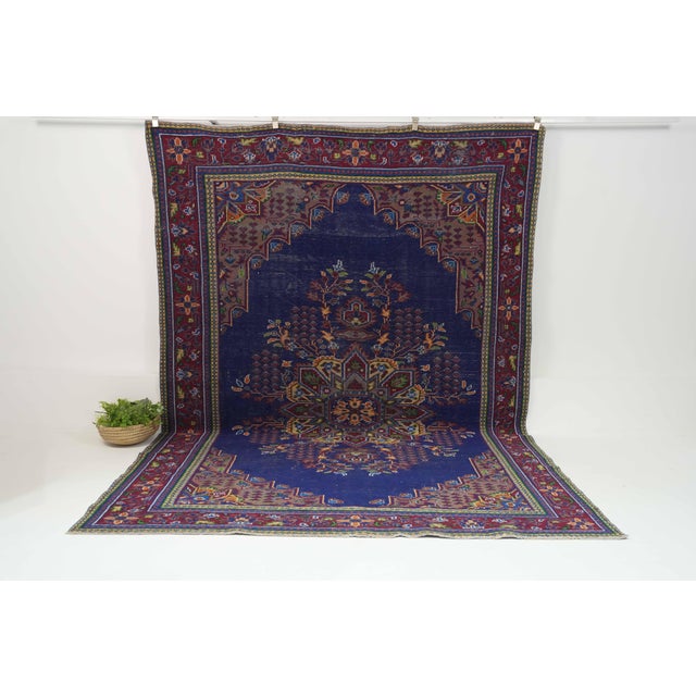 Vintage Hand-Knotted runner rug is a semi-antique vintage area rug. The '70s Eastern region of Anatolia's unique rug is...