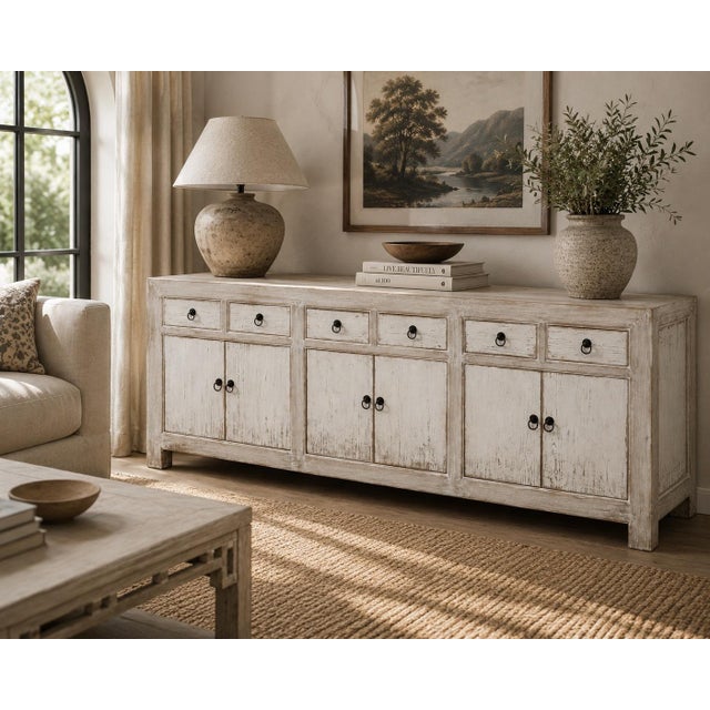Handcrafted from reclaimed solid wood, this grand 91-inch two-tone buffet cabinet brings timeless architectural warmth and...