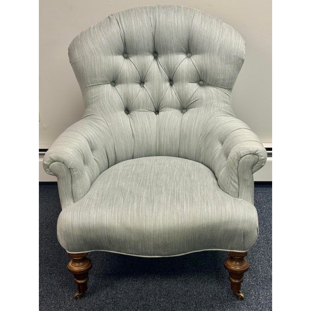 Elegant tufted armchair upholstered in a soft pale sage/blue-gray textured fabric. Exceptionally well made with...