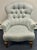 Elegant tufted armchair upholstered in a soft pale sage/blue-gray textured fabric. Exceptionally well made with...
