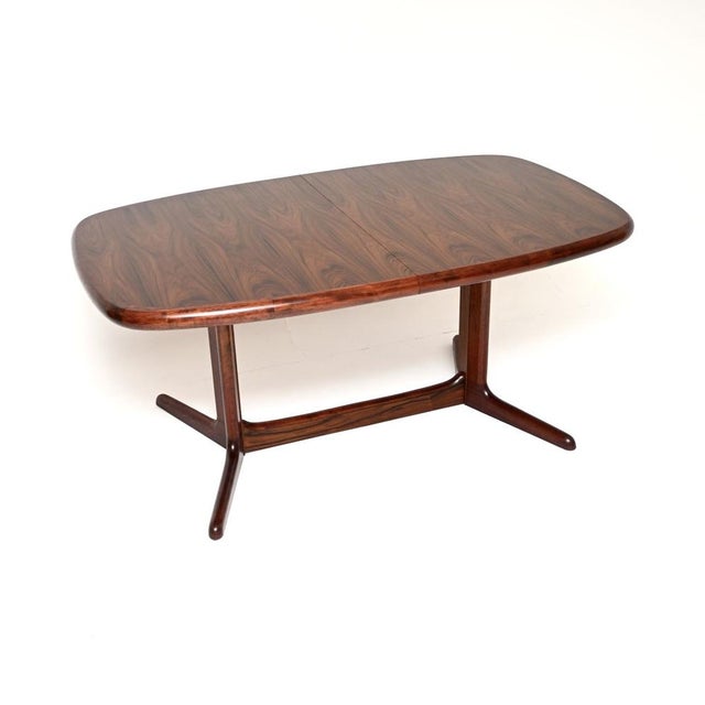 A very stylish, top quality and very large Danish vintage extending dining table. This was made in Denmark, it dates from...