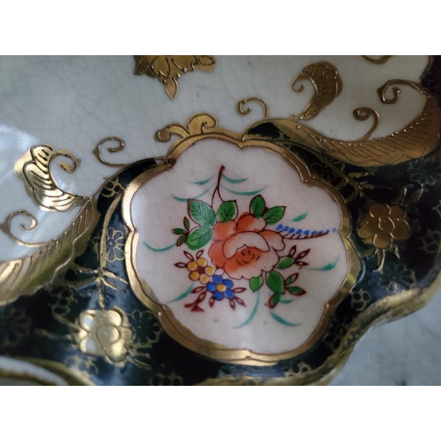 Porcelain Candy or Serving dish. Has a metal handle in the center that screws in. There is some light crazing throughout...