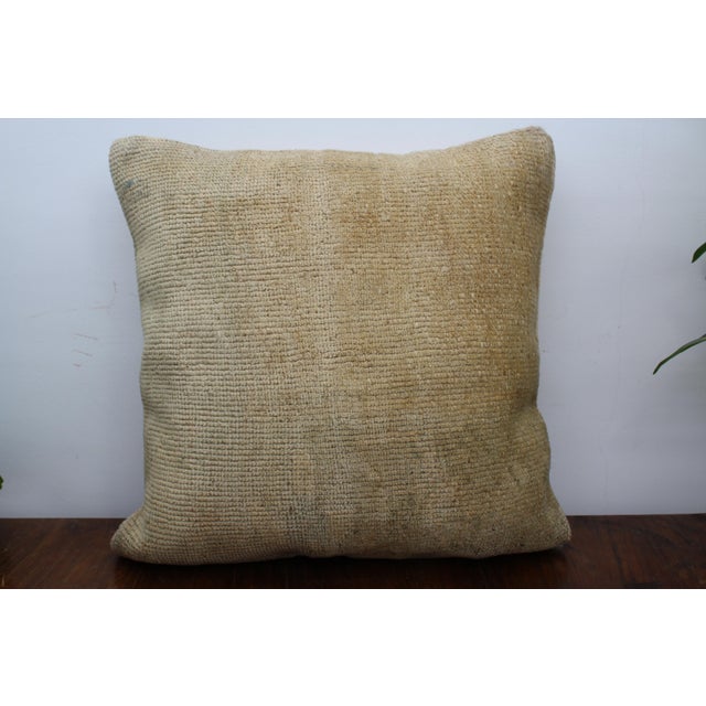This Turkish pillow cover is made from the highest quality antique rug in 100% wool on the front. The back is covered in...