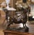 Powerful in expression and finely modeled, this antique bronze sculpture depicts a muscular bull standing proudly in an...