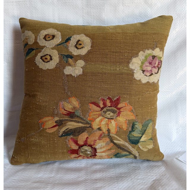 This beautiful antique tapestry pillow is created from a historic French Aubusson-style tapestry fragment featuring an...