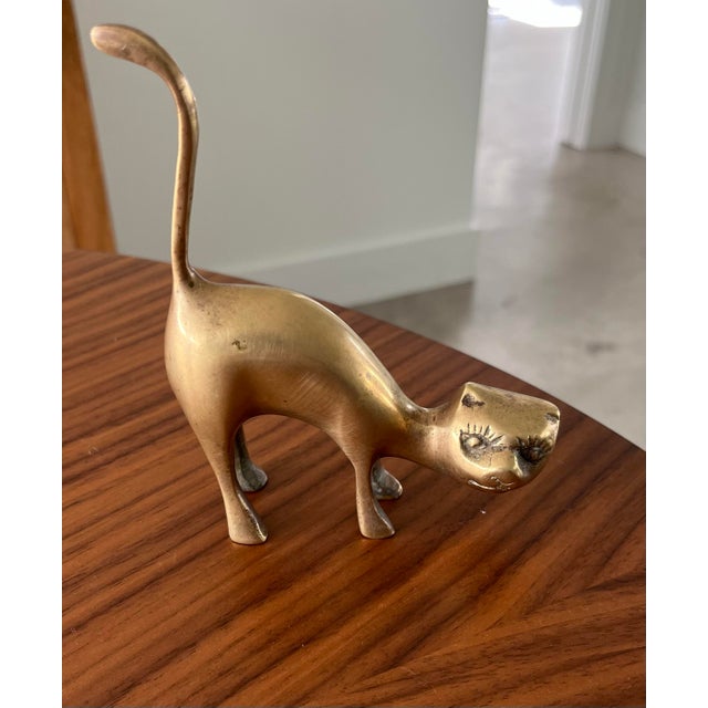 Meee...Owwww. This mid-century feline figure fresh off of a nap in a sun patch is ready take over your home. A purrrfect...