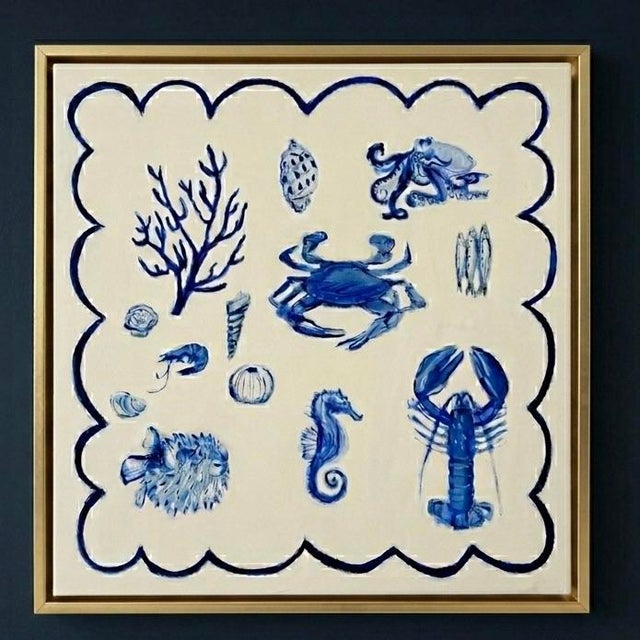 A sophisticated coastal composition featuring hand-painted sea life specimens in a timeless palette of layered blues and...
