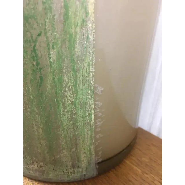 This monumental Art Deco floor vase, a creation of renowned artist Anatole Riecke, stands as a testament to the era's...