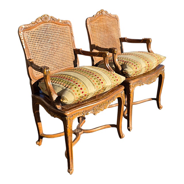 Pr of Early 20th Century French Louis XV Style Carved Walnut Fauteuils W/Cane Seats & Backs, Original Painted Highlights W/Loose Upholstered Cushions For Sale