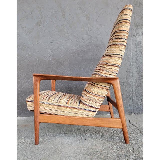 Teak Scandinavian Modern high-back reclining lounge chair. Designed by Folke Ohlsson for DUX of Sweden. Circa. 1960....
