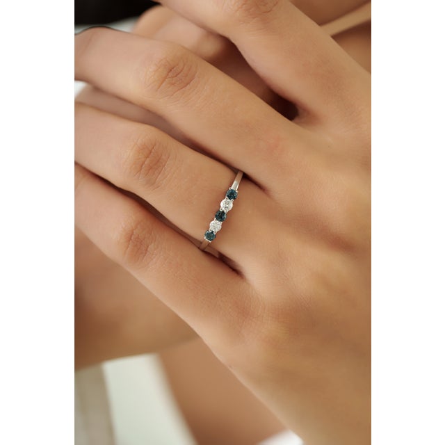 This five stone ring features a 0.25 carats of blue sapphires set in 14k white gold. Each sapphire measuring 2.5 mm in...