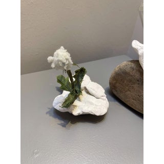 Grasping by Ashley Folkner | Mixed Media Sculpture of a flower on a rock For Sale