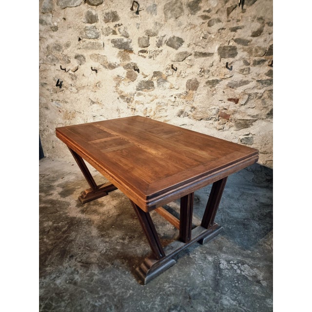 Vintage French dining table in the Arts & Crafts style, crafted from solid oak and dating from the 1930s–1940s. This table...