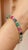 This Glamorous Emerald, Ruby and Sapphire Tennis Bracelet with Diamonds in 14K gold showcases 18 endlessly sparkling...