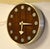 This 1970s mid-century modern wall clock, designed by Arthur Umanoff for Howard Miller, features a striking Zebra Wood...