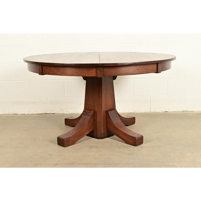 An exceptional antique Mission or Arts & Crafts quarter sawn oak pedestal extension dining table By Stickley Brothers USA,...