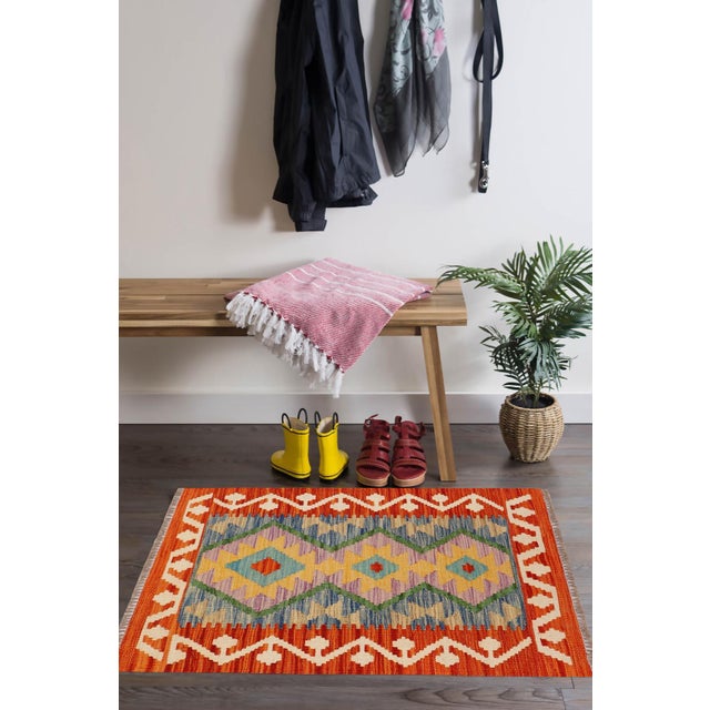 Elevate the elegance of your home with this stunning hand-woven tribal Kilim wool rug. Meticulously crafted on a loom by...