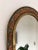 Vintage decorative wall mirror from Spain with an arched shape and a brass-toned frame with copper-colored and silver-...