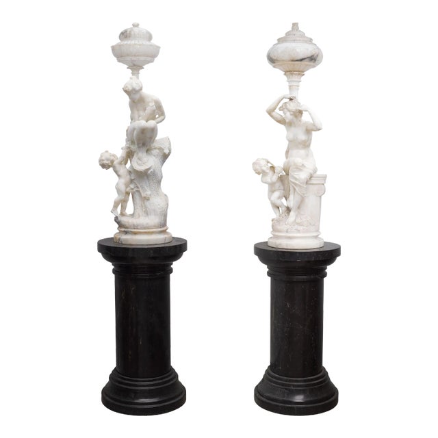 Pair of Monumental Antique Italian Carved Alabaster Venus & Cupid Figural Torchiere Lamps on Black Marble Pedestals For Sale