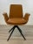 Timeless warm Mid- Century Modern Style Butterscotch Faux Leather Desk Chair, black metal base, showroom floor sample