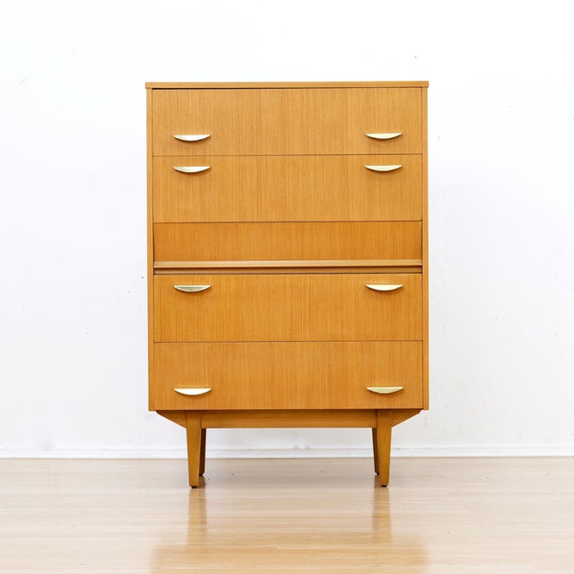 This Mid century chest of drawers was produced by Symbol furniture. A handsome dresser with five full width drawers, slim...