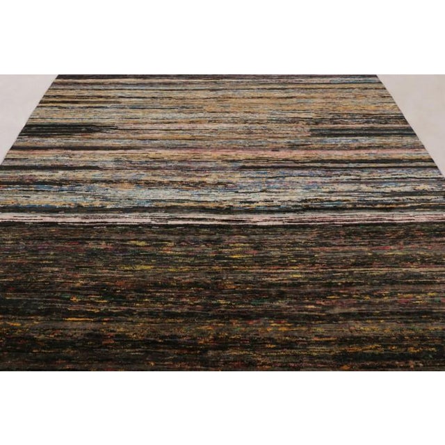 Hand-knotted in luxurious sari silk, this 8x10 rug is a rich new addition to Rug & Kilim’s Textural collection, featuring...