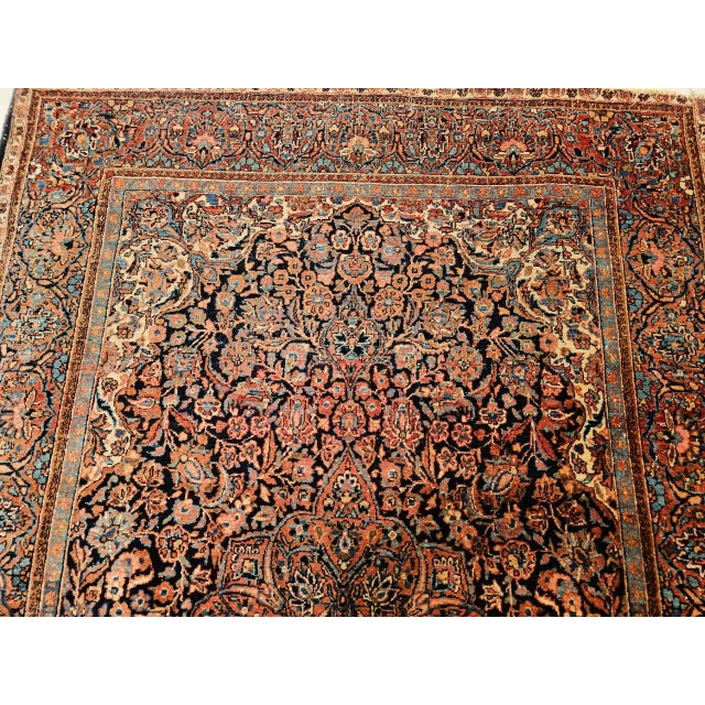 Vintage Persian Kashan Area Rug, meticulously hand-knotted in the early 1900s. This beautiful rug features an intricate...