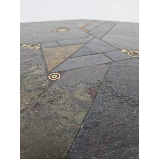 A brutal, octagonal coffee table designed by Paul Kingma in the 1980s. The octagonal top is lined with natural stone,...