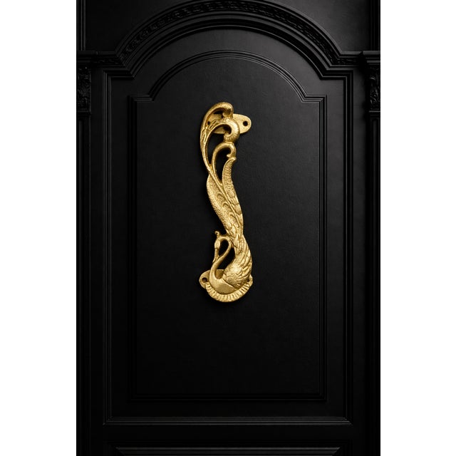 Beautifully crafted metal door handle in the shape of a peacock, with the tail feathers forming a graceful swoop. Mounting...