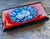 A striking mid-century Japanese lacquer smoking box or decorative table accessory featuring dramatic red and black...