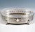 Elegant silver jardinière in an elliptical shape standing on four goat's feet with acanthus leaf connections, straight...
