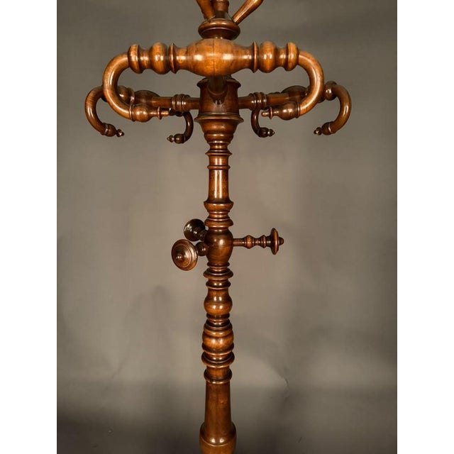 Early 19th-century Italian hall tree and coat rack crafted in walnut, originating from the Piedmont region of Italy and...
