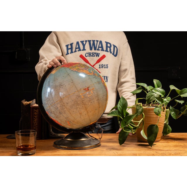 c. 1940s; Replogle Globes, Inc. - Chicago, IL Mid-century globe lamp made up of twelve chromolithographed paper gores laid...