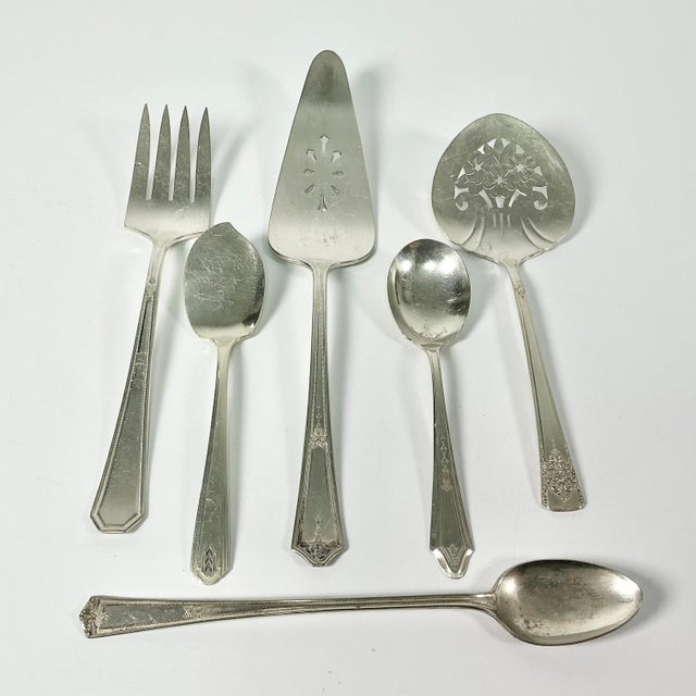 A lovely collection of Art Deco Silverplate Serving Utensils from makers Wm Rogers, Roger’s Bros, Winfield and Oneida....
