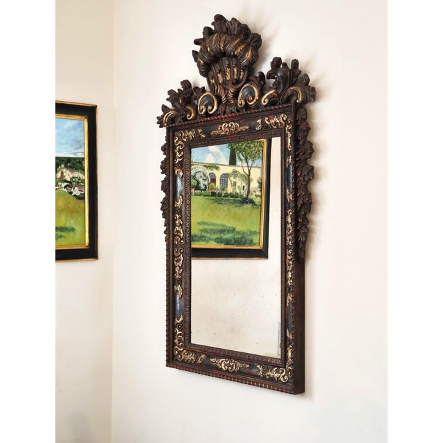 An imposing wall mirror made in Northern Italy between the 1950s and 1960s, inspired by the decorative models of the...