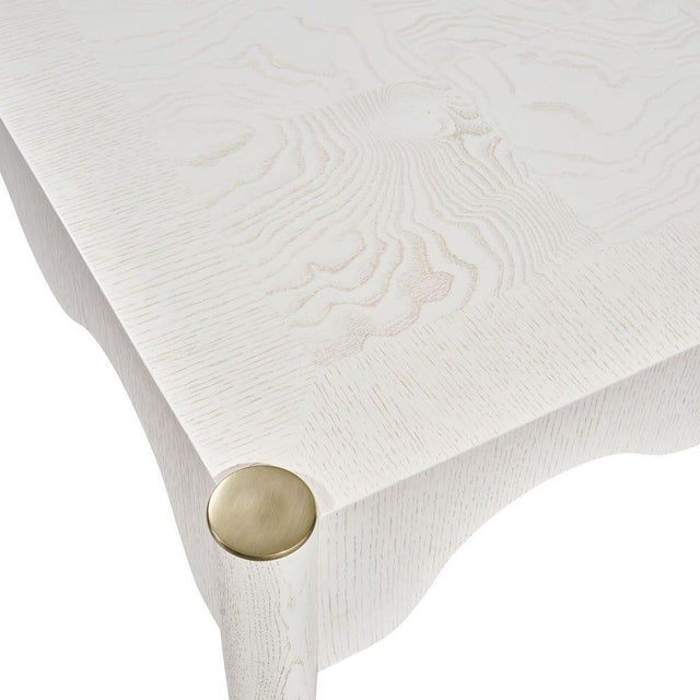 This fun and flirty table features a curvy apron, brass capped flared legs, stylish solid brass feet. Crafted in hardwoods...