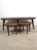 This mid century coffee table features hardwood construction, kidney bean shape with embossed leather top featuring rural...