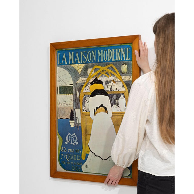 This mid 20th century poster from France is a poster, housed in a wood and glass frame. Its design carries the Modern...