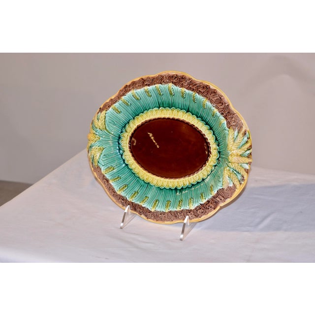 19th century Majolica bread tray from England in the wheat pattern. The tray has a central medallion of solid brown,...