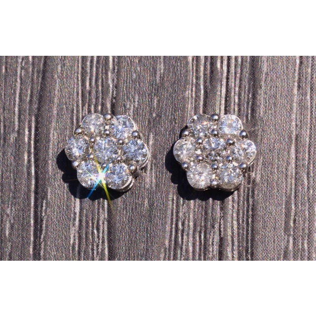 The Cardiff: White Gold and Diamond Cluster Earrings. These diamond filled cluster earrings make a statement with their...