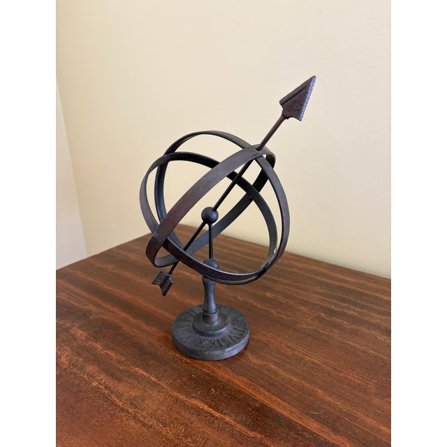 A beautifully crafted iron armillary sphere, evoking the timeless elegance of classical European gardens. Pieces like this...