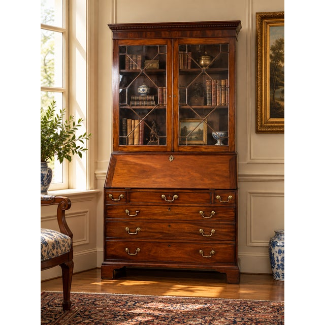 This late 18th century George III secretary with bookcase is a handsome and versatile piece of English furniture. Crafted...