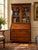 This late 18th century George III secretary with bookcase is a handsome and versatile piece of English furniture. Crafted...